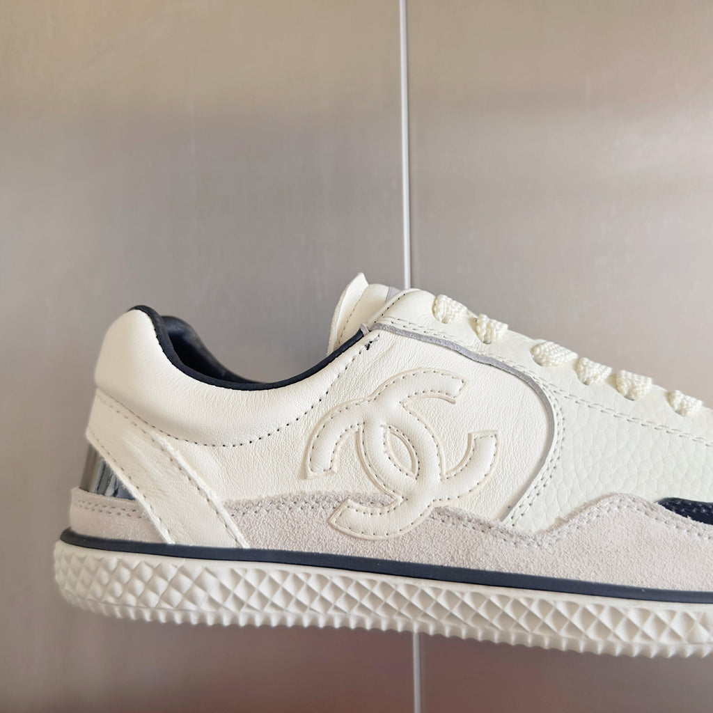 CHANEL 25S SNEAKERS WITH PATENT TOE 20MM IN WHITE CALFSKIN