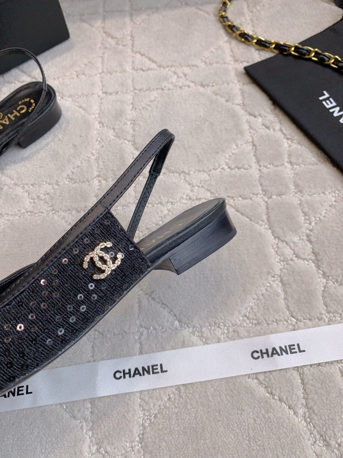 CHANEL 25S SLINGBACK IN SPARKLING BLACK CALFSKIN AND CANVAS GOLD HARDWARE