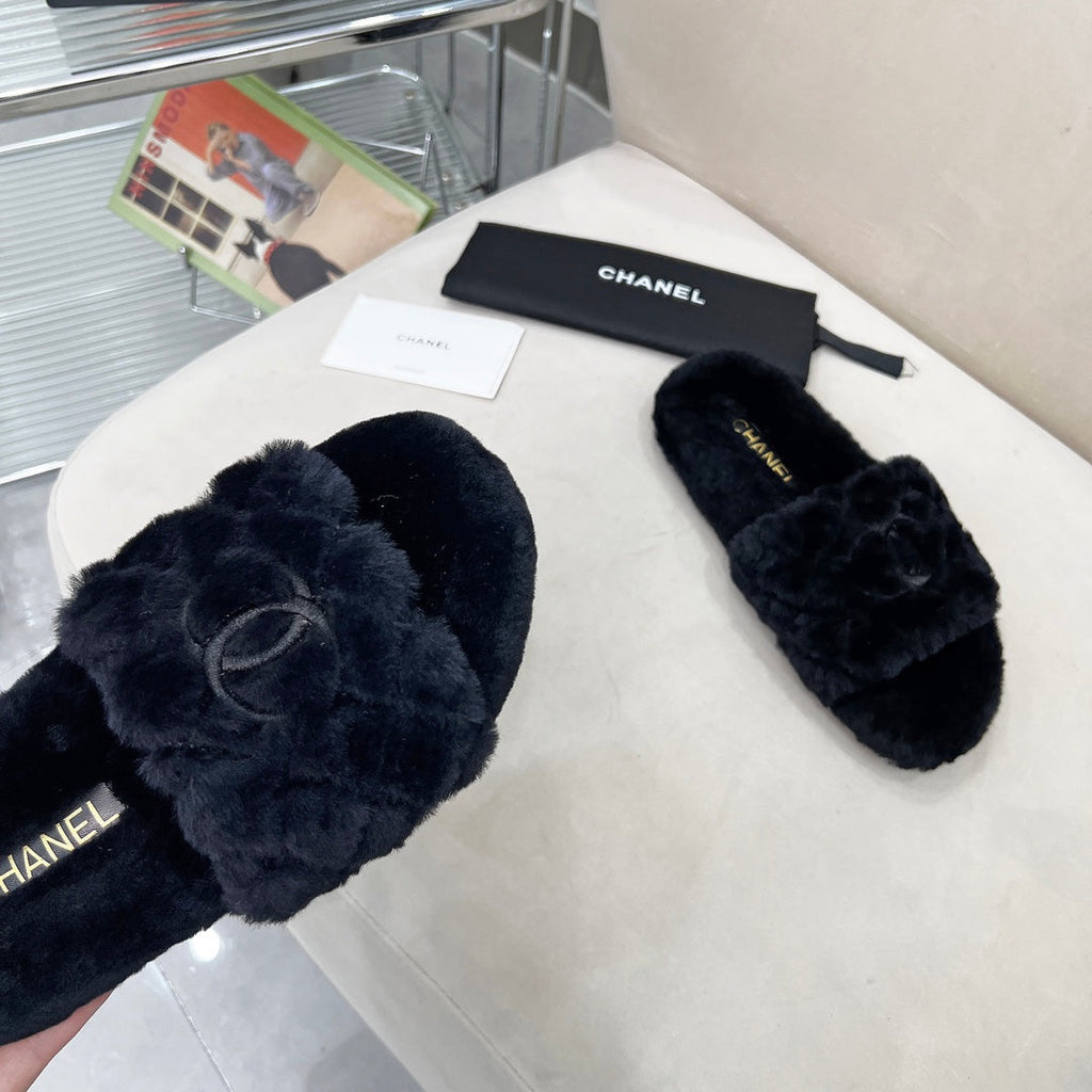 CHANEL 25S FUR SLIPPERS WITH EXPOSED-STITCH STRAPS IN BLACK