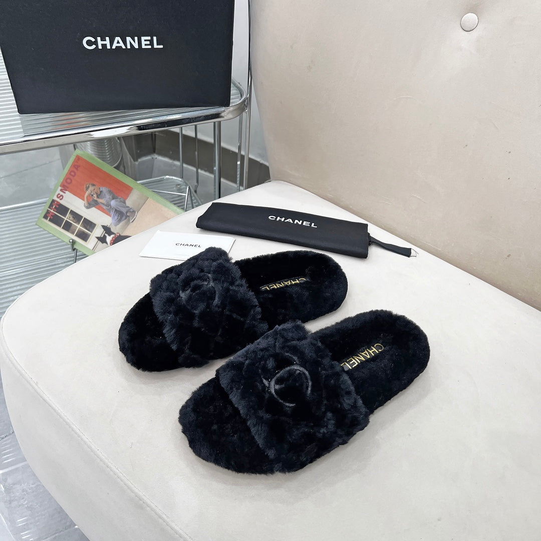 CHANEL 25S FUR SLIPPERS WITH EXPOSED-STITCH STRAPS IN BLACK