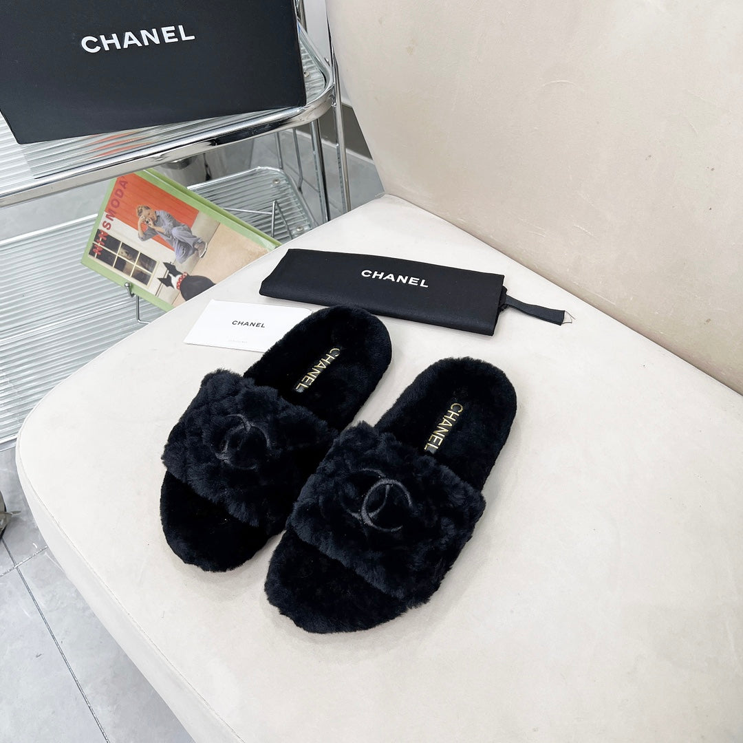 CHANEL 25S FUR SLIPPERS WITH EXPOSED-STITCH STRAPS IN BLACK